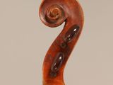an old violin with a wooden back and a long neck