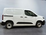 a picture of a white van parked in a garage