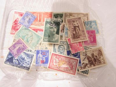 a lot of stamps in a plastic bag on a table