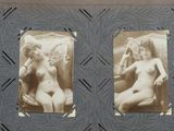 an old photo of two nude women sitting on a chair