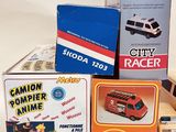 many different types of toy vehicles on the table