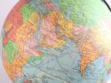 a close up of a small globe on a table