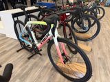 many bikes lined up on the floor in the store