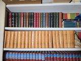 a lot of books on the shelves in the room