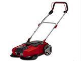 a red lawn mower sitting on top of a white surface