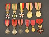 a group of medals and medals on display on a black surface