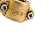 a close up of a brass plate with a screw on it