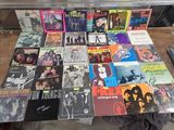 a lot of records that are on a table
