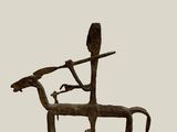 statue of a man on a horse with a bird on its back