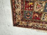 a picture of a rug hanging on a wall