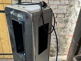 a silver suitcase sitting on the ground next to a brick wall