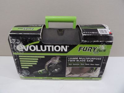 an image of a box with a green handle on a white table