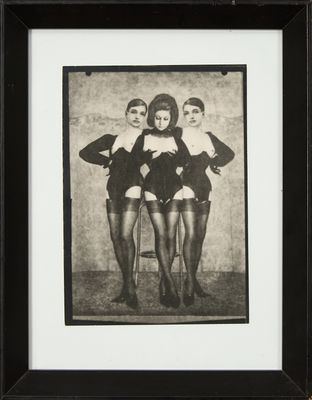 black and white photograph of three women in lingersuits posing for a picture