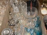 a box full of glassware on a table