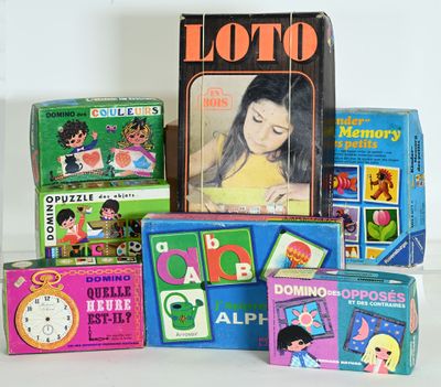 a lot of children ' s books and toys sitting on a table