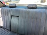 the back seat of a car with two buttons on it