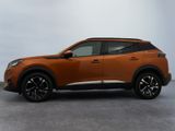 the orange nissan c - hr suv is parked in a parking lot