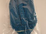 a blue sponge in a plastic bag on a table