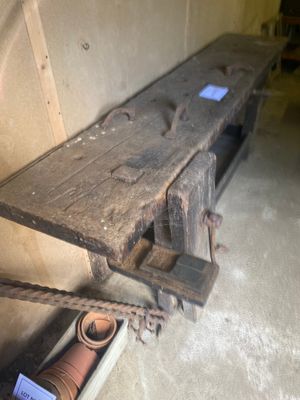 a wooden bench that is sitting in the corner of a room