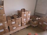 many boxes stacked on top of each other in a room