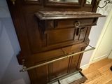 a mirror on a wooden cabinet in a room