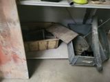 a metal shelf with a bunch of items in it