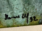 a close up of a piece of art with writing on it