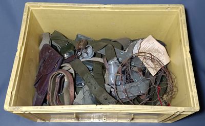 a yellow box filled with assorted items on a blue surface