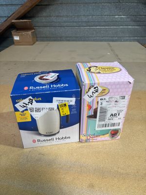 two boxes of coffee sitting on a table next to each other