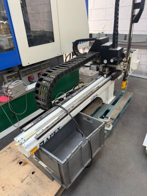 an image of a machine that is working on a piece of wood