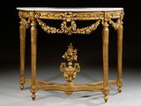 une table console ornementale sculptée avec un plateau en marbre