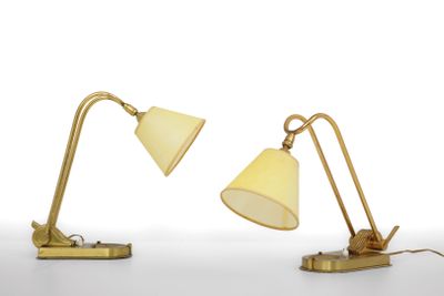 two lamps on a white surface with a white background