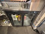 a glass door that has a bunch of wine glasses on it