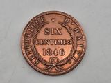 a close up of a coin on a white surface