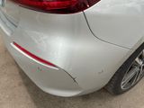 a close up of a car ' s tail light and bumper