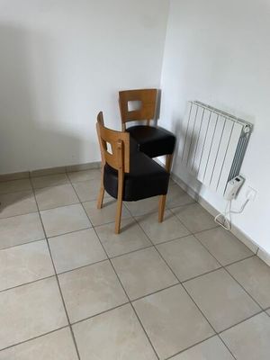 a chair and a table in the corner of a room