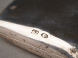 a silver case that has a small number on it
