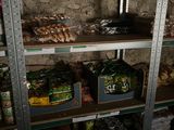 many shelves of food and condiments in a store