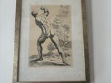 a framed picture of a man holding a tennis racquet on a wall