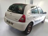 a picture of a white car parked in a garage