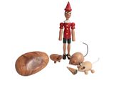 a wooden toy that is standing next to other toys
