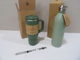 a green coffee mug next to a green water bottle and a pen