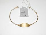 a close up of a gold bracelet with a tag on it