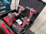 three tools in a case that are sitting on a table