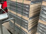 many stacks of boxes stacked on top of each other