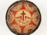 a picture of a button with a cross on it