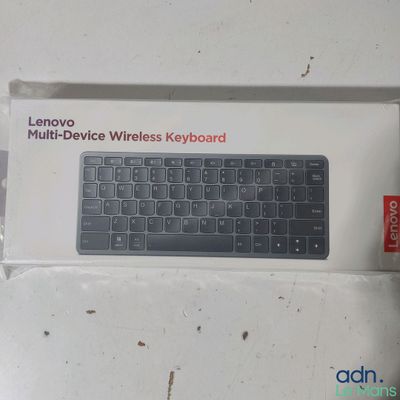 a white box with a black keyboard inside of it