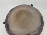 a brown bowl sitting on top of a white table
