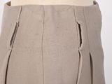 a close up of a woman ' s skirt with a zipper down the side