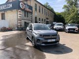 a car parked in front of a building in a parking lot